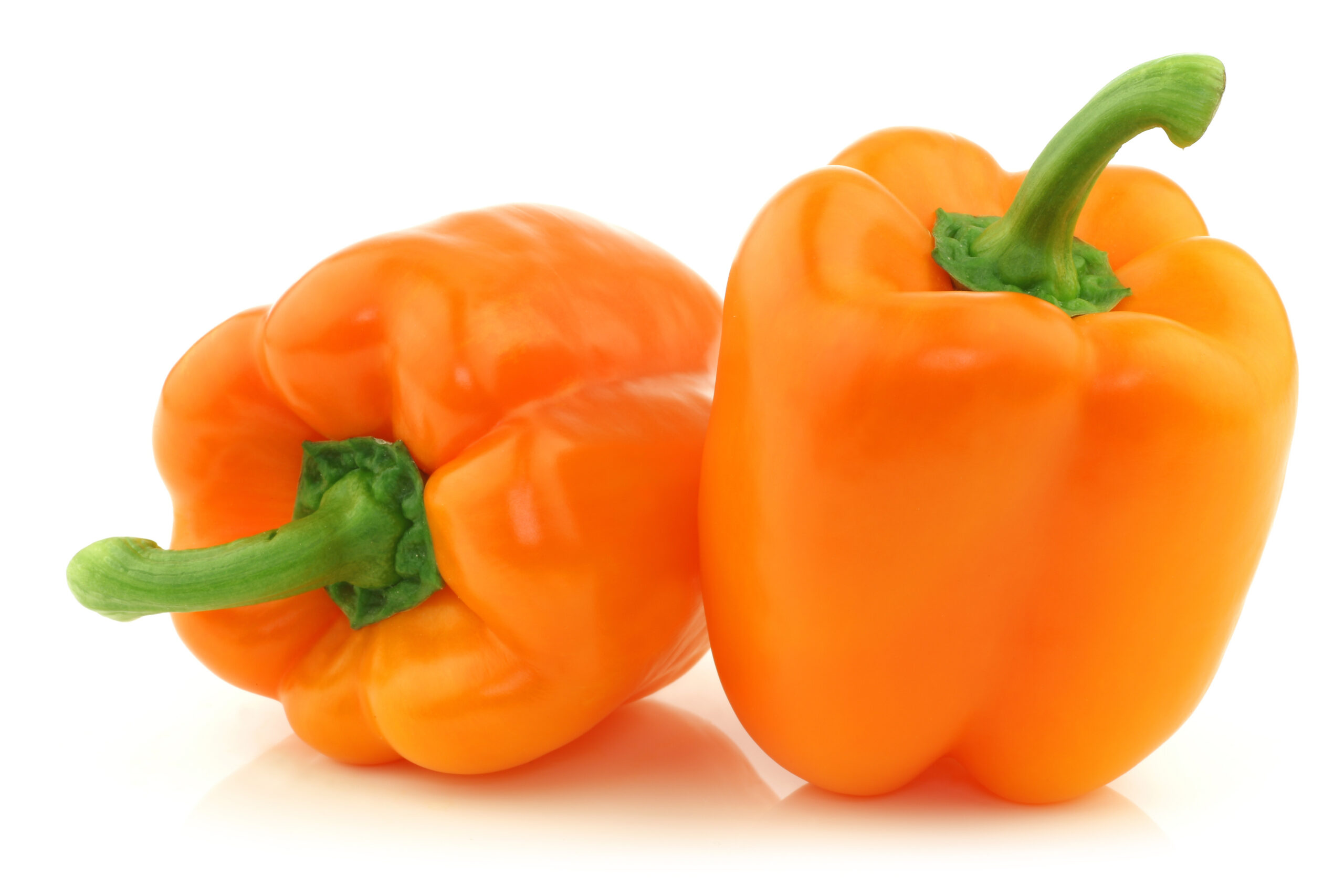 Two,Fresh,Orange,Bell,Peppers,On,A,White,Background ΠΙΠΕΡΙΕΣ ΠΟΡΤΟΚΑΛΙ - Image 1